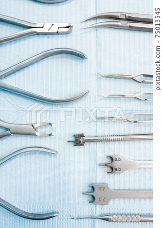 Dental tools for orthodontic treatment lying on the table 75013545