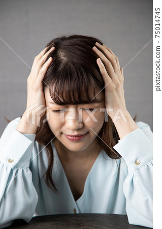 A young woman with poor physical condition A young woman with poor physical condition 75014745