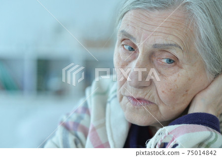 Portrait of tired senior woman at home Portrait of tired senior woman at home 75014842
