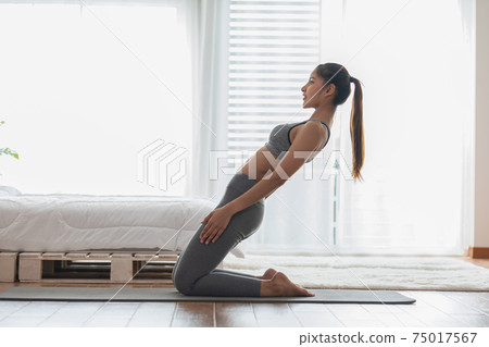 Athletic Healthy Asian indian woman in sportswear workout excercise at home in bedroom,Young woman with slim body cardio aerobic exercises healthy lifestyle concept Athletic Healthy Asian indian woman in sportswear workout excercise at home in bedroom,Young woman with slim body cardio aerobic exercises healthy lifestyle concept 75017567