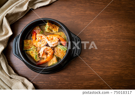 Sour soup made of Tamarind Paste with Shrimps and Vegetable Omelet 75018317