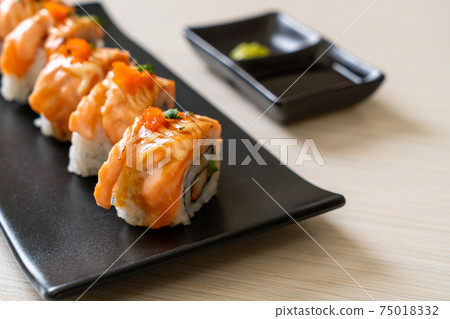 grilled salmon sushi roll with sauce grilled salmon sushi roll with sauce 75018332