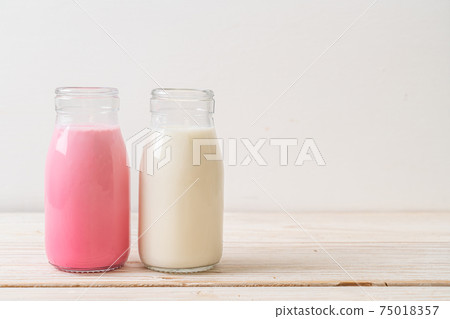 pink milk or strawberry milk with fresh milk in bottle pink milk or strawberry milk with fresh milk in bottle 75018357