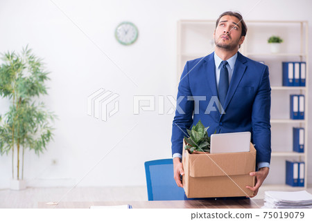 Young man being fired from his work 75019079