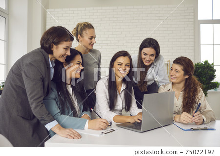 Happy business women meeting in office and discussing ideas for their online store Happy business women meeting in office and discussing ideas for their online store 75022192