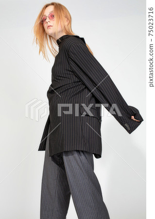 White european young woman isolated on gray White european young woman isolated on gray 75023716