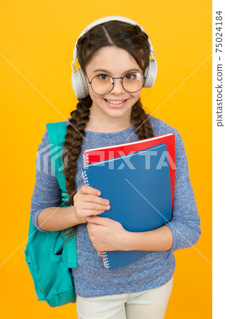 English library online. Happy kid wear headphones. English library online. Happy kid wear headphones. 75024184
