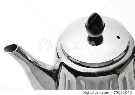 Vintage silver teapot on a white background Vintage silver teapot on a white background 75025049