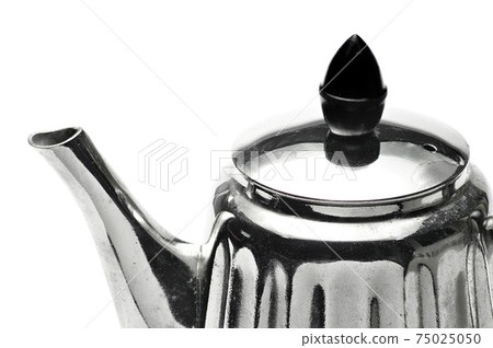 Vintage silver teapot on a white background Vintage silver teapot on a white background 75025050