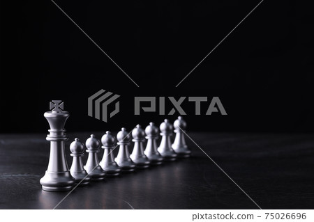 Business chess board game of business strategy and tactic on retro wooden table, idea for management competition, success and leadership concept with copy space for your advertising content. Business chess board game of business strategy and tactic on retro wooden table, idea for management competition, success and leadership concept with copy space for your advertising content. 75026696