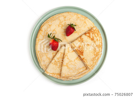 Pancake on the green plate on white background Pancake on the green plate on white background 75026807