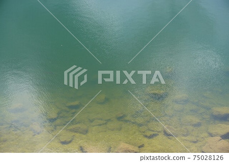 Visible bottom of the water with a view of the bottom of the water Visible bottom of the water with a view of the bottom of the water 75028126