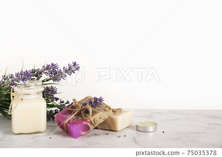 Lavender cosmetics products and flowers. Home body skin care, set of bathroom accessories Lavender cosmetics products and flowers. Home body skin care, set of bathroom accessories 75035378