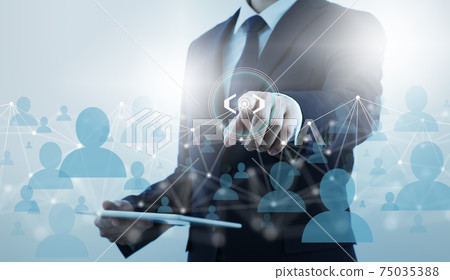 Communication technology and networks of people. A man who uses the internet to get in touch with people. Communication technology and networks of people. A man who uses the internet to get in touch with people. 75035388
