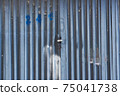 Old grunge and dirty metal closeup of steel door with door handles and lock vintage retro style background and texture in Sofia, Bulgaria, Eastern Europe 75041738