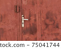Old grunge and dirty metal closeup of steel door with door handles and lock vintage retro style background and texture in Sofia, Bulgaria, Eastern Europe 75041744