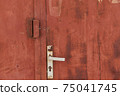 Old grunge and dirty metal closeup of steel door with door handles and lock vintage retro style background and texture in Sofia, Bulgaria, Eastern Europe 75041745