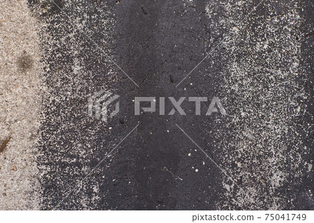 Grey texture of old broken asphalt road or wall big abrasions cracks holes on the surface pebbles cement in Sofia, Bulgaria, Eastern Europe Grey texture of old broken asphalt road or wall big abrasions cracks holes on the surface pebbles cement in Sofia, Bulgaria, Eastern Europe 75041749