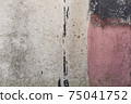 Grey texture of old broken asphalt road or wall big abrasions cracks holes on the surface pebbles cement in Sofia, Bulgaria, Eastern Europe 75041752