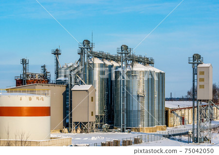 Snowy silos in winter 75042050