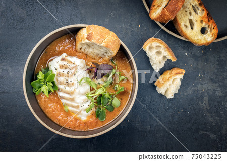 Traditional French fish soup with codfish and crouton  75043225