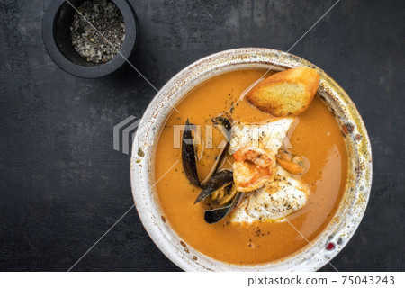 Traditional French fish soup with prawns and mussels Traditional French fish soup with prawns and mussels 75043243