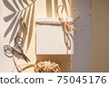 White gift box tied with twine. Mockup for your design, minimalistic style. 75045176