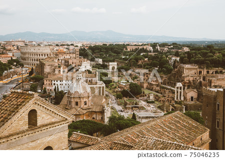 Panoramic view of city Rome with Roman forum and Colosseum from Vittoriano 75046235