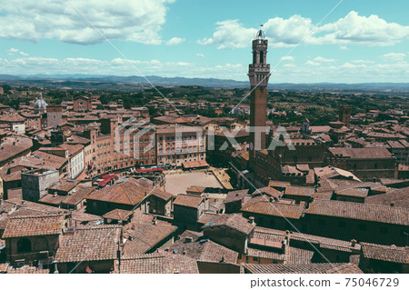 Panoramic view of Siena city with Piazza del Campo and the Torre del Mangia Panoramic view of Siena city with Piazza del Campo and the Torre del Mangia 75046729