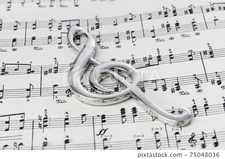 Treble clef on music sheet - musical background Treble clef on music sheet - musical background 75048036