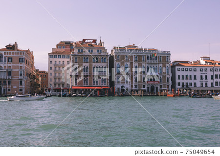 Panoramic view of Grand Canal (Canal Grande) with active traffic boats Panoramic view of Grand Canal (Canal Grande) with active traffic boats 75049654