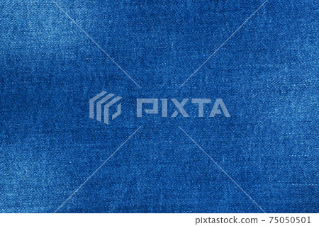 Texture blue denim with scuffs, background material of jeans. Texture blue denim with scuffs, background material of jeans. 75050501