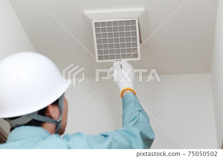 Male worker inspecting ventilation openings Male worker inspecting ventilation openings 75050502
