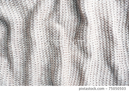 Texture beige knitted wool, background textile material. Close up. Texture beige knitted wool, background textile material. Close up. 75050503