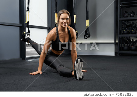 Smiling woman sitting on the twine. Smiling woman sitting on the twine. 75052823