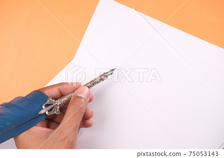 Close up of man hand writing a letter with fountain pen Close up of man hand writing a letter with fountain pen 75053143