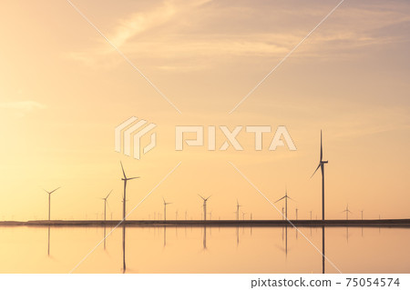 Tranquil minimalist landscape with rows offshore wind turbines 75054574