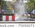 Excavator digging   a road. Construction concept. 75056073