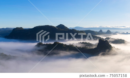 Mountain landscape and morning mist. Mountain landscape and morning mist. 75057158