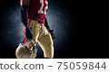 Sportsman with ball in helmet on stadium in action. Sport wallpaper. Team sports. 75059844