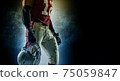 Sportsman with ball in helmet on stadium in action. Sport wallpaper. Team sports. 75059847