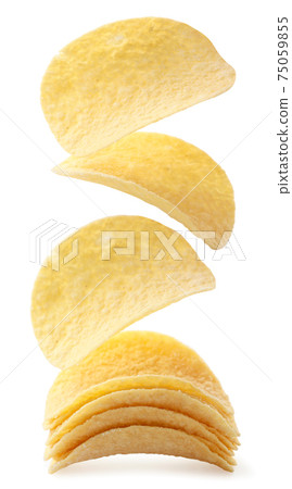 Potato chips are falling on a heap on a white background. Isolated Potato chips are falling on a heap on a white background. Isolated 75059855