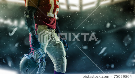 Sportsman with ball in helmet on stadium in action. Sport wallpaper. Team sports. 75059864