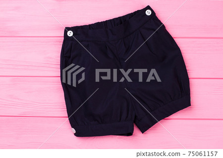 Navy shorts on pink background Navy shorts on pink background 75061157