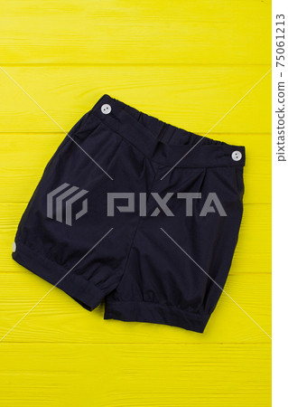 Navy shorts on yellow shelf Navy shorts on yellow shelf 75061213