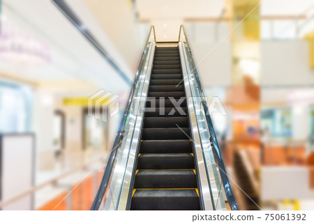 Escalator in business center 75061392