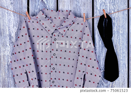 Boys garment hanging on rope. Boys garment hanging on rope. 75061523