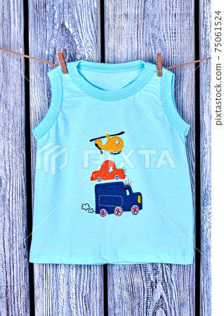 Baby boy printed t-shirt hanging on rope. Baby boy printed t-shirt hanging on rope. 75061524