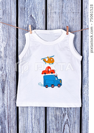 Baby boy t-shirt hanging on rope. Baby boy t-shirt hanging on rope. 75061528
