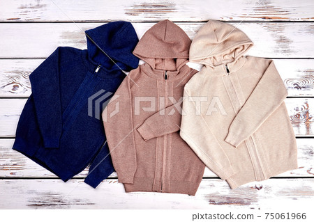 Collection of new knitted hooded sweaters. 75061966